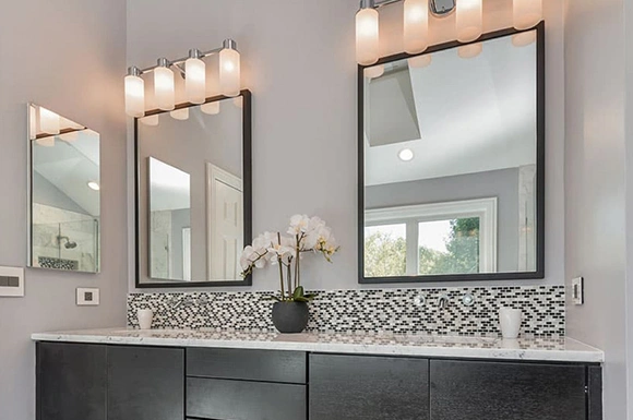 Modern bathroom with dual vanity mirrors.