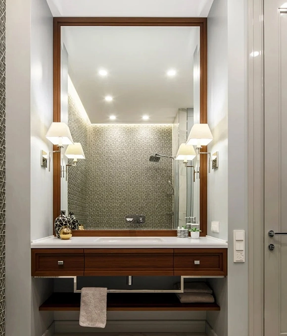 Stylish bathroom with elegant mirror and lighting.