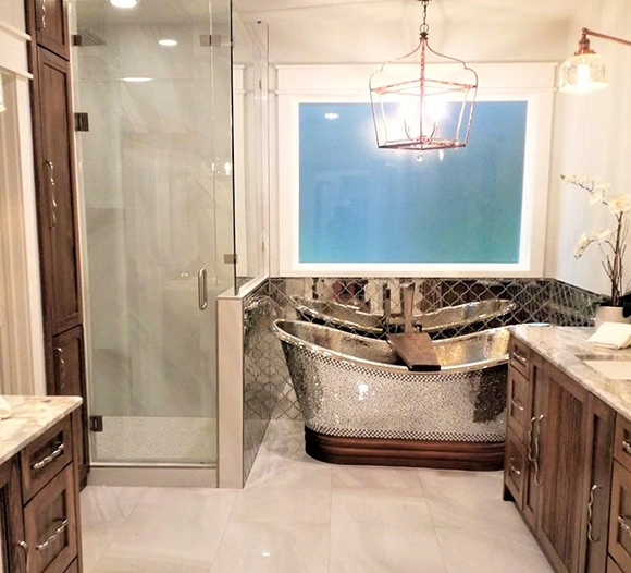 Modern bathroom featuring a stylish shower door and freestanding tub.