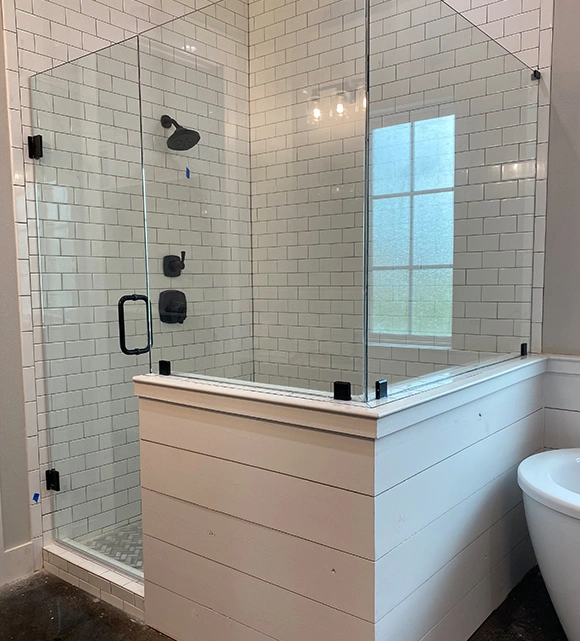 Nice bathroom with a glass shower door and cool fixtures.