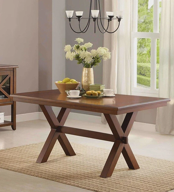 Elegant wooden dining table with flowers and fruits.