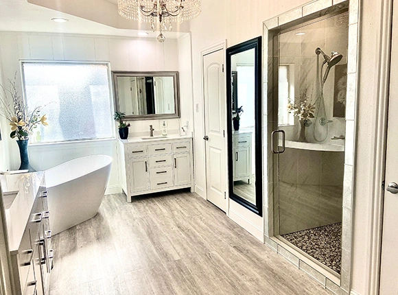 Modern bathroom with a bathtub and shower.